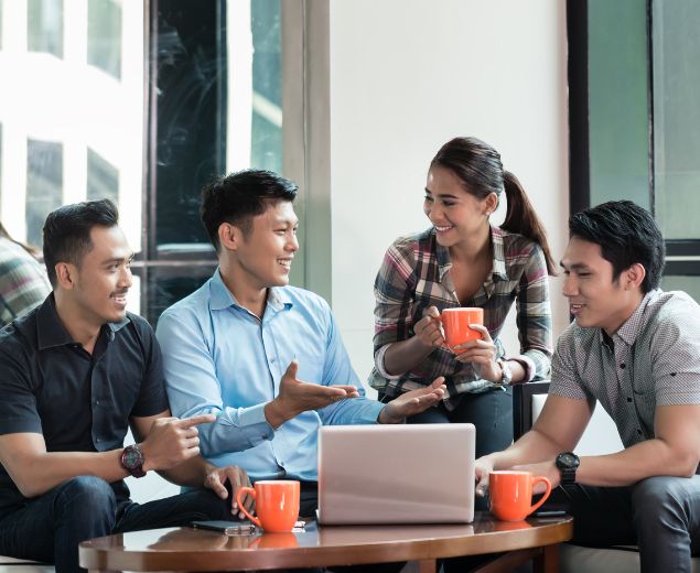 Career Page: Additional Perks of SCU Jobs group around table image Career Page: Additional Perks of SCU Jobs group around table image