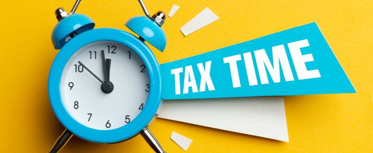 Image of a blue old-timey alarm clock on a bright yellow background with a TAX TIME banner
