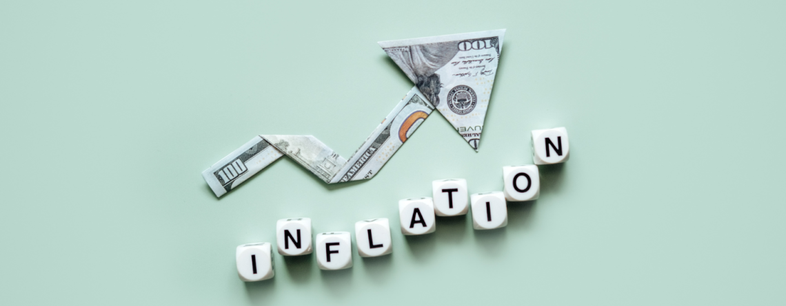 Inflation words with money arrow climbing higher