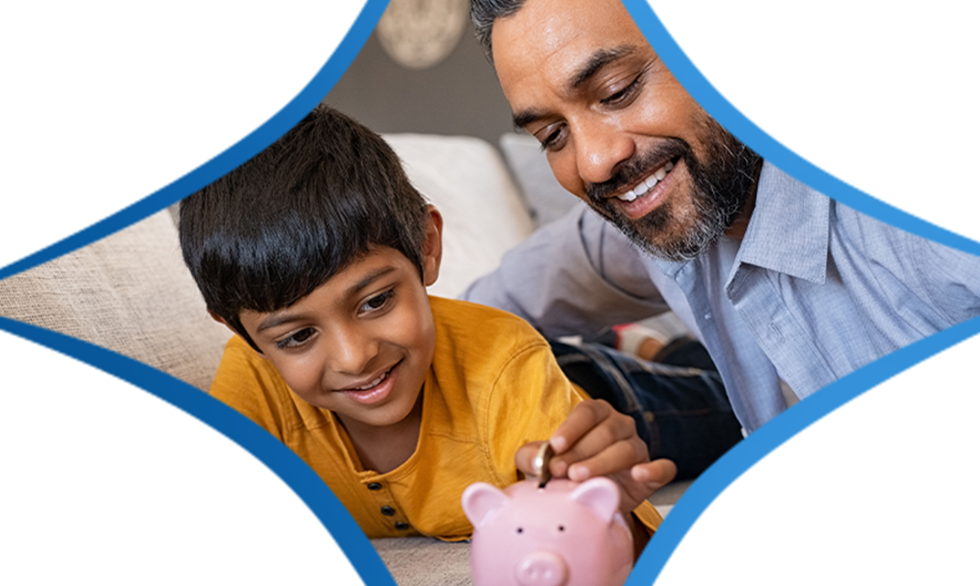 Father and Son adding money to a piggy bank.
