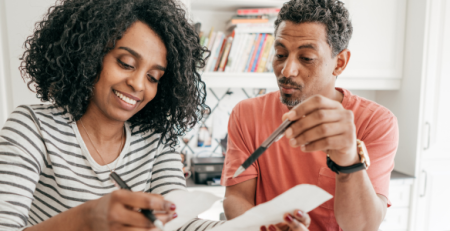 A couple reviewing financial documents to avoid common 2026 tax filing mistakes with Scott Credit Union in Missouri and Illinois.