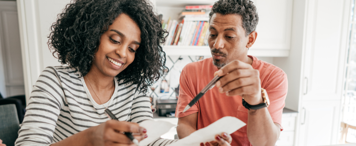 A couple reviewing financial documents to avoid common 2026 tax filing mistakes with Scott Credit Union in Missouri and Illinois.