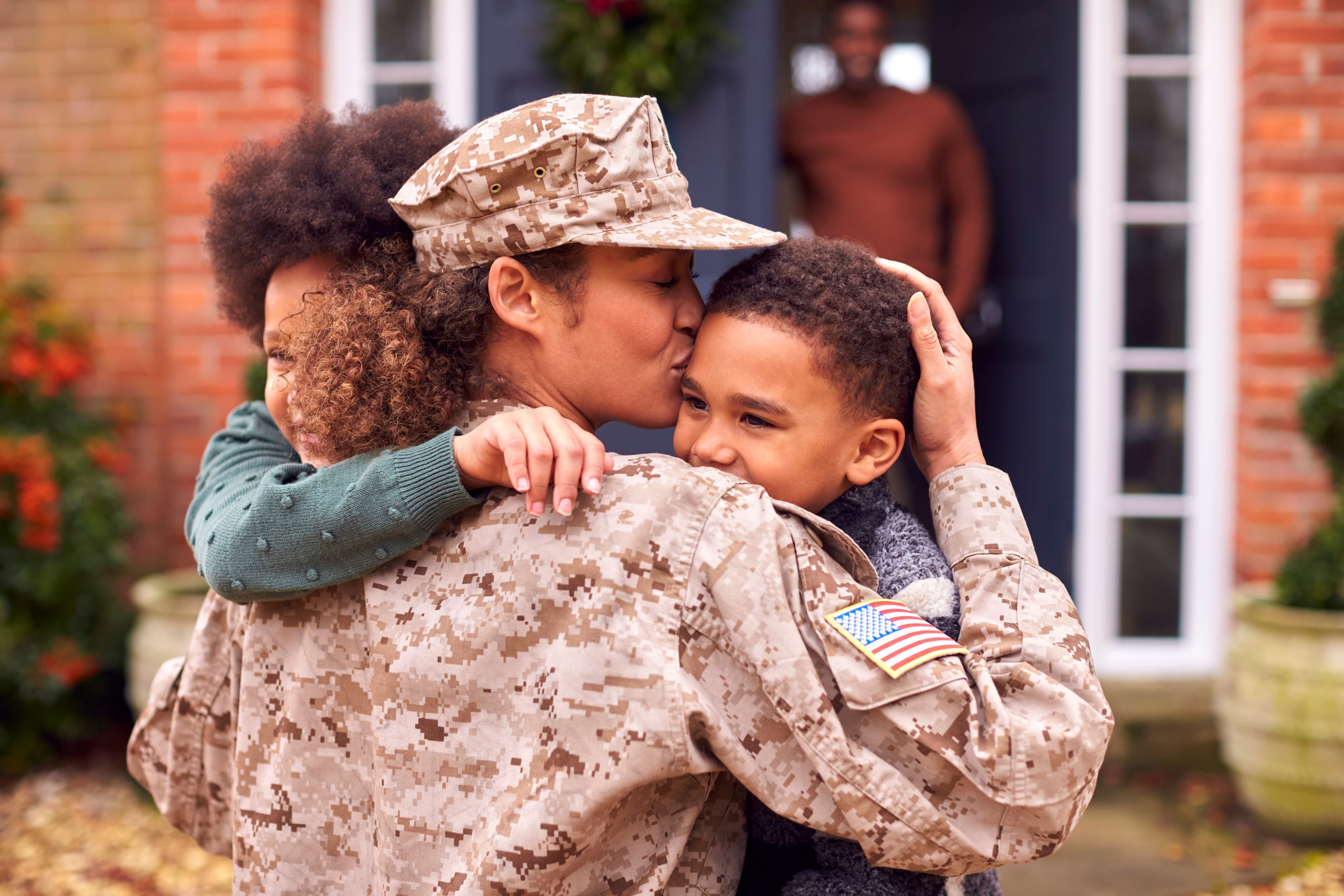 AdobeStock 482608304 United States Soldier with kids
